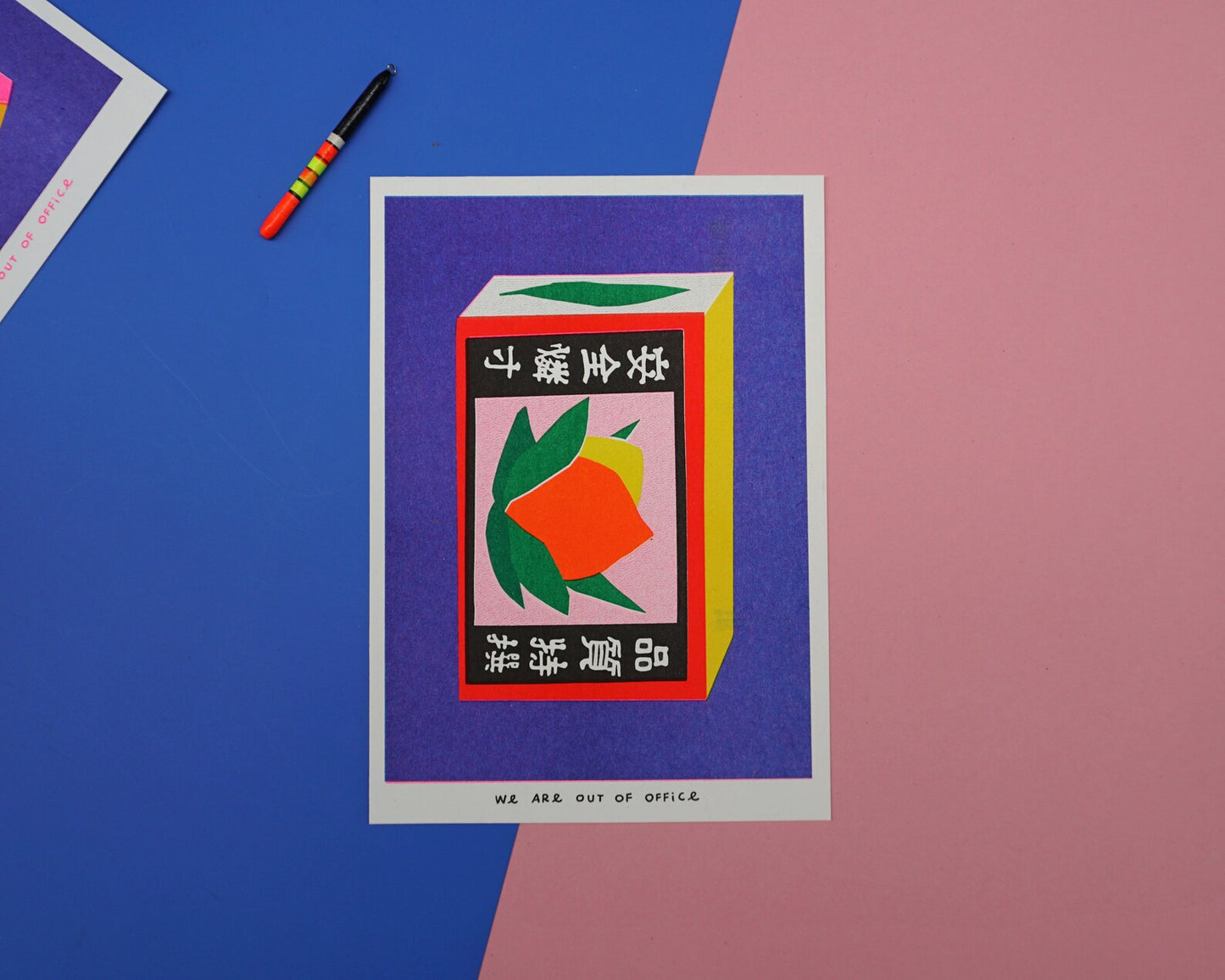 Colorful risoprint of a vintage Japanese matchbox with bold fruit illustration and kanji symbols, modern wall art by We Are Out Of The Office, 13 x 18 cm print made in the Netherlands.