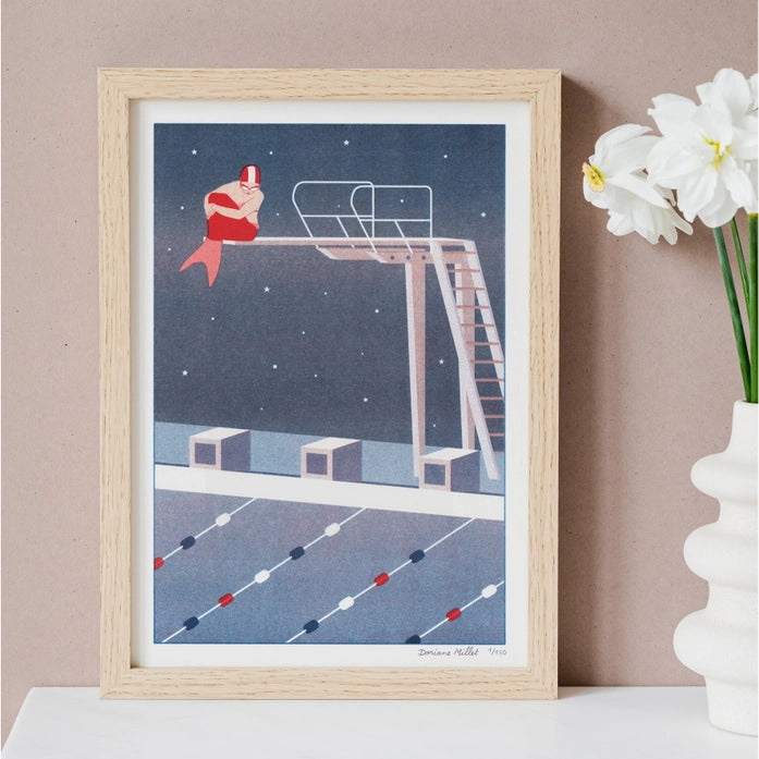 Art print of a modern mermaid sitting on a diving board under a starry sky in a swimming pool, risograph by French illustrator Doriane Millet – limited edition A4 illustration printed in France.