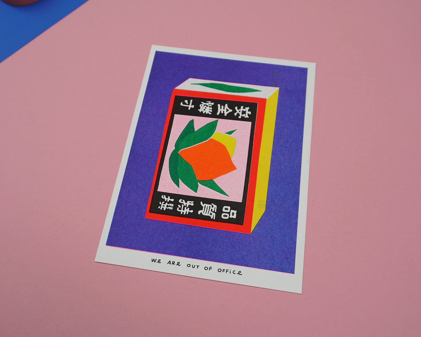 Colorful risoprint of a vintage Japanese matchbox with bold fruit illustration and kanji symbols, modern wall art by We Are Out Of The Office, 13 x 18 cm print made in the Netherlands.