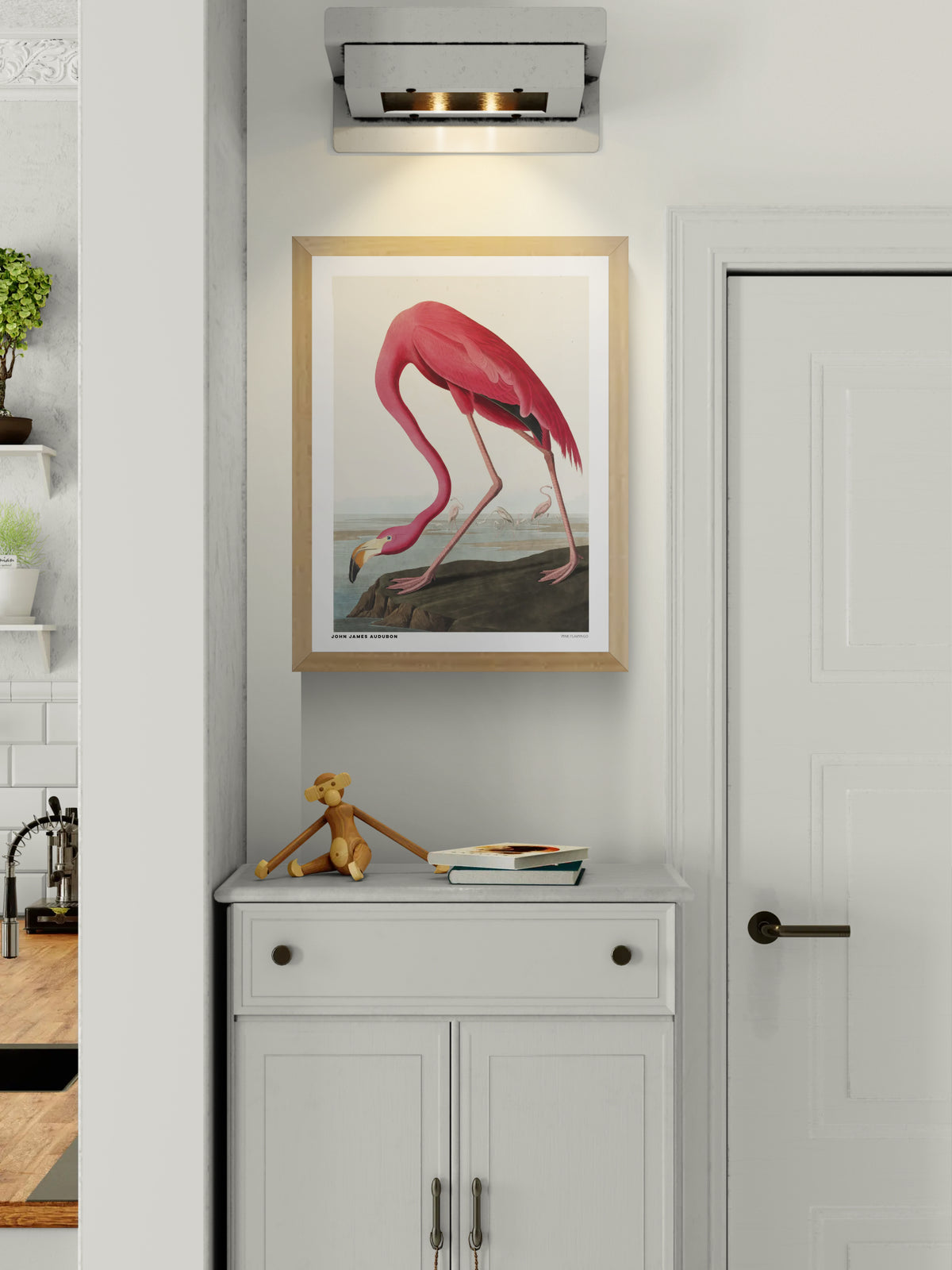 Vintage natural history illustration of a bright pink flamingo bending its long neck toward the water, with smaller flamingos in the background. Detailed vertical wildlife artwork by John James Audubon, ideal for colorful wall decor.