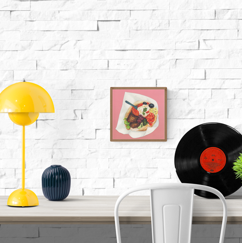 "Falafel" by Kim Timmermans – vibrant watercolor illustration of a fresh falafel pita filled with colorful vegetables, olives, hummus, and herbs on a pink background, perfect for food art lovers and modern kitchen wall decor, available at Galerie Frits