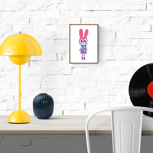 Handmade screenprint of a whimsical fuchsia pink rabbit wearing a playful blue dress and boots, designed by Plumo. Cute and bold animal illustration perfect for kids’ room decor or as a unique art gift. Limited edition A5 art print made in the Netherlands