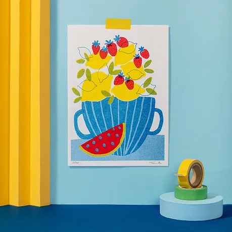 A5 risograph art print titled Lemonade by Teresa Rego, featuring a colorful blue cup filled with lemons, strawberries, and a slice of watermelon – limited edition Portuguese illustration on 150g paper.
