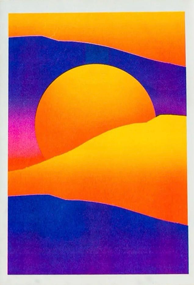 Striking 12.5 x 17.5 cm risograph print of a surreal desert landscape with glowing orange sand dunes, deep purple shadows, and a radiant yellow sun setting behind rolling hills. Modern minimalist wall art with bold colour contrast, designed by Dutch illustrator PTRVRKD and handprinted in the Netherlands using eco-friendly soy inks.