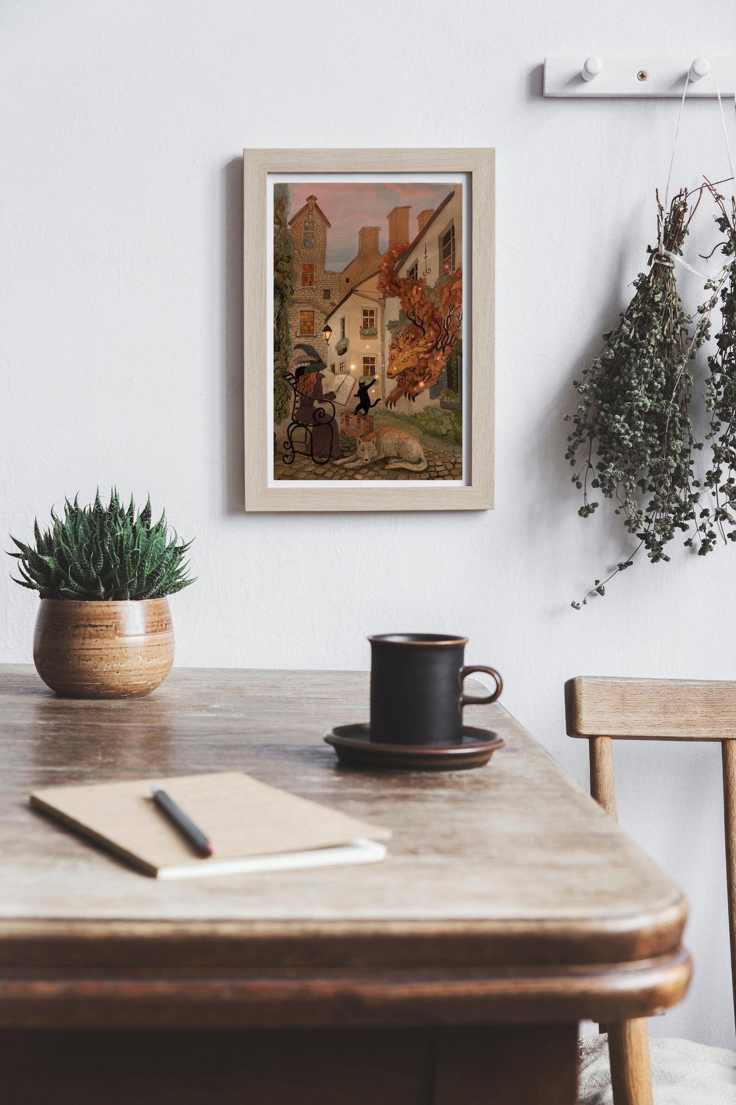 Enchanting giclée art print by Lena Yampolski featuring a whimsical witch reading a spellbook in a charming Antwerp courtyard with a black cat, a glowing leaf creature, and warm streetlight tones. Perfect wall art for lovers of fantasy, witches, and European magic scenes.