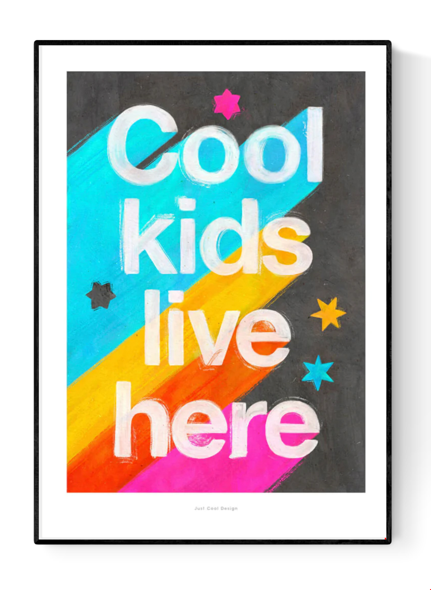 Giclée art print by Just Cool Design with the phrase "Cool kids live here" in bold white letters over a bright rainbow background with stars, ideal for colorful children's rooms or playful modern decor.