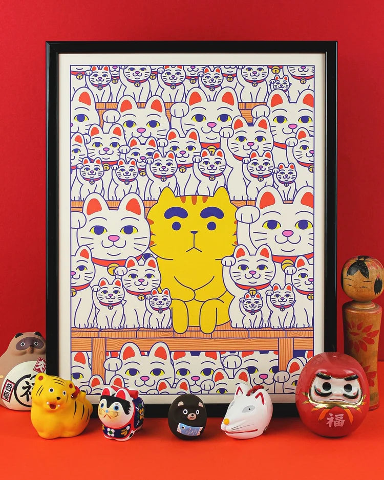Maneki-Neko art print by Yeaaah! Studio featuring a bright yellow cat among hundreds of white Japanese lucky cats with raised paws, inspired by Gotoku-ji Temple in Tokyo. Digital print on 300g Old Mill Premium White paper, available in 30x40 cm or 50x70 cm, printed in France, unframed.