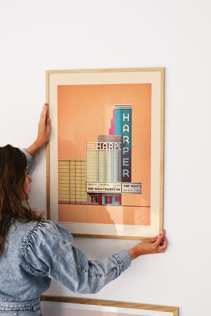 The Harper Theater 1939 by Sander Patelski, large 50 x 70 cm architectural digital art print featuring a vintage Art Deco cinema facade in warm peach, blue, and red tones with retro typography and minimalist urban design.
