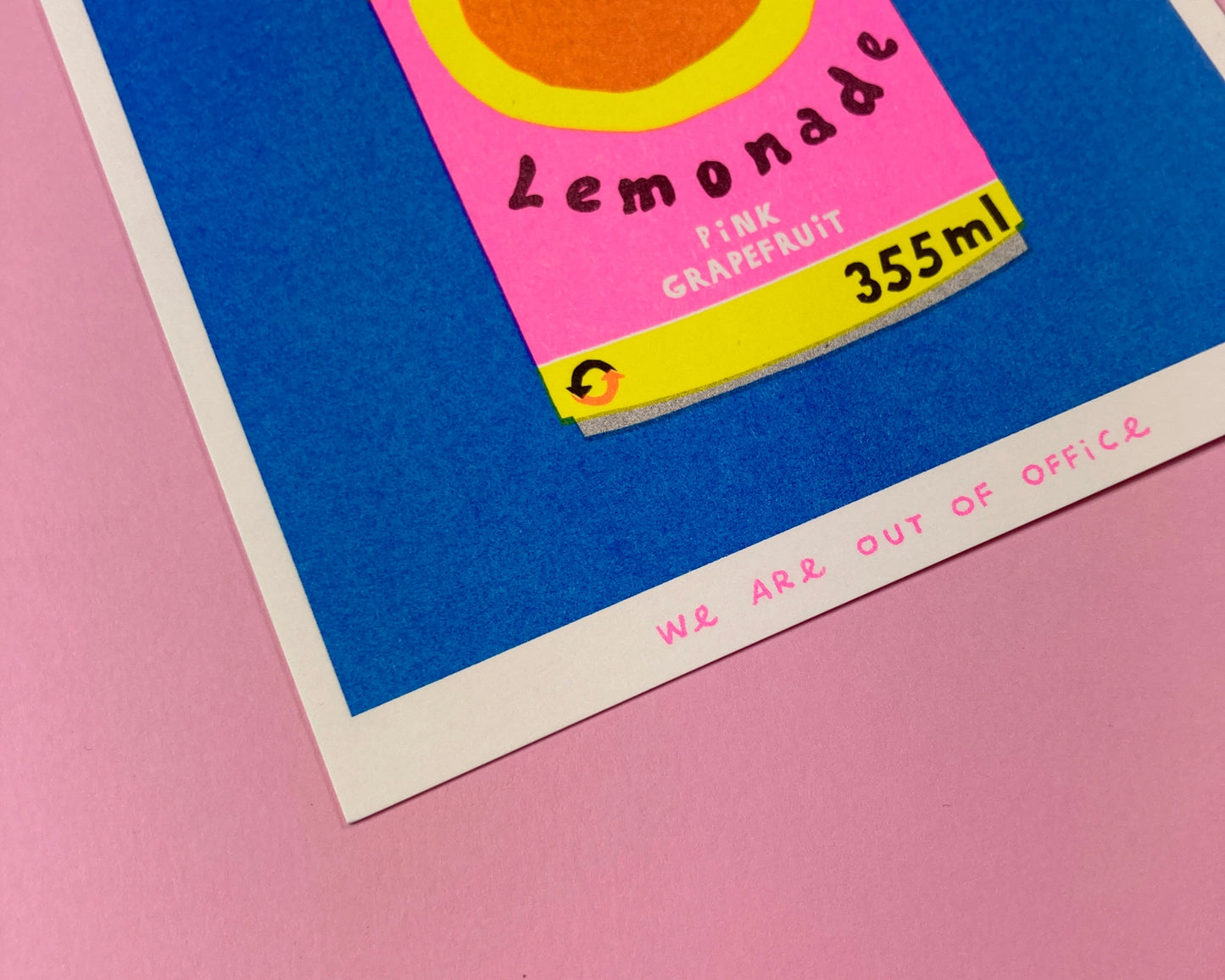 Colorful risograph print of a retro-style Paloma lemonade can with pink grapefruit label on blue background – Paloma Lemonade by We Are Out Of Office, 13 x 18 cm art print.