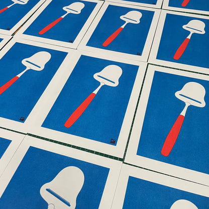 Minimalist risograph art print titled Cheese Slicer by VrijFormaat, featuring a red-handled cheese slicer on a deep blue background. Bold two-tone design inspired by everyday Dutch kitchen objects, printed on Biotop 160g paper in Utrecht. Perfect wall art for modern interiors and design enthusiasts.