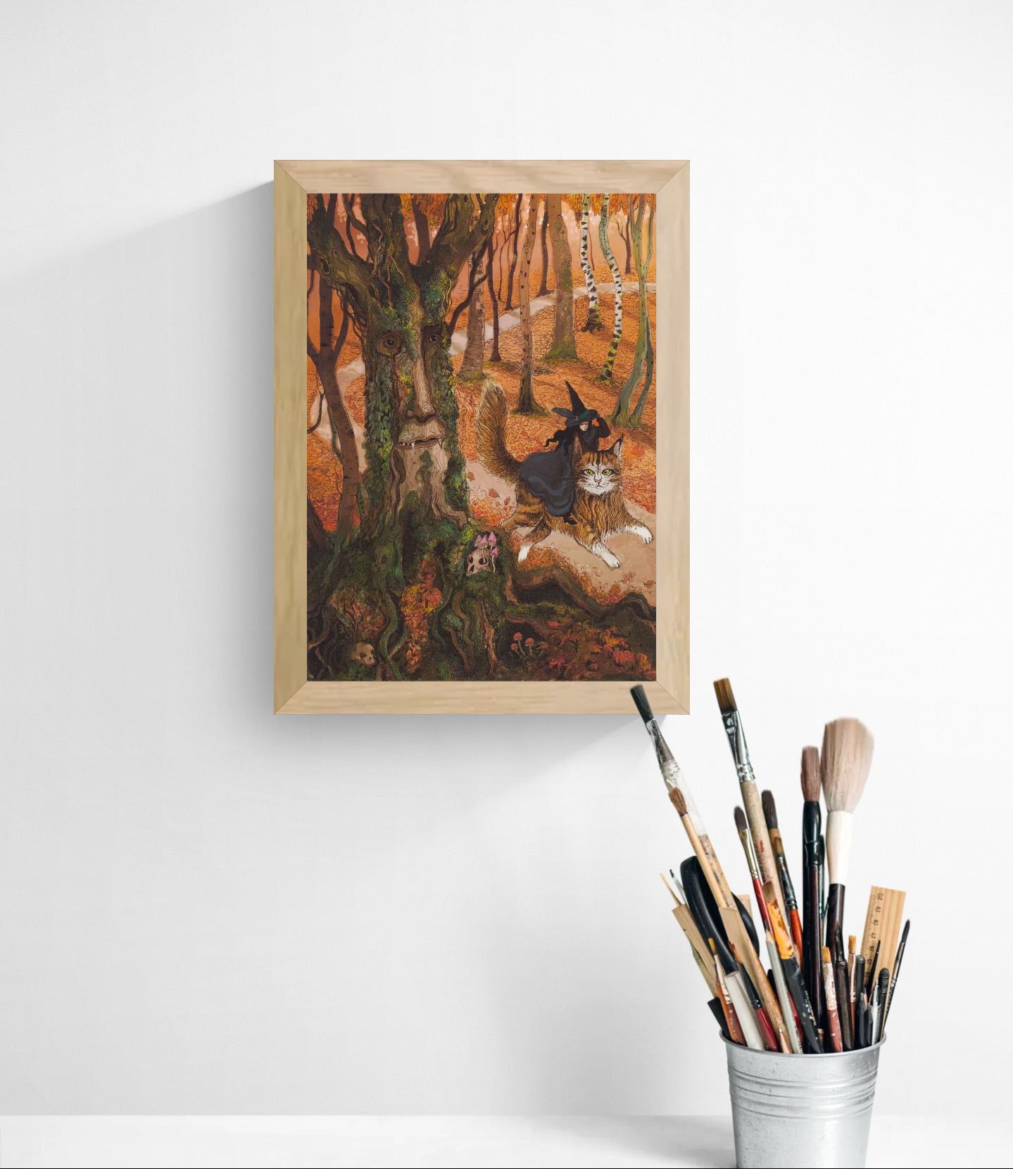 Whimsical autumn forest illustration featuring a witch riding a giant cat beside an ancient tree spirit with a human face, detailed fantasy artwork in warm orange, green, and brown tones, vertical giclée wall art for cosy home decor.