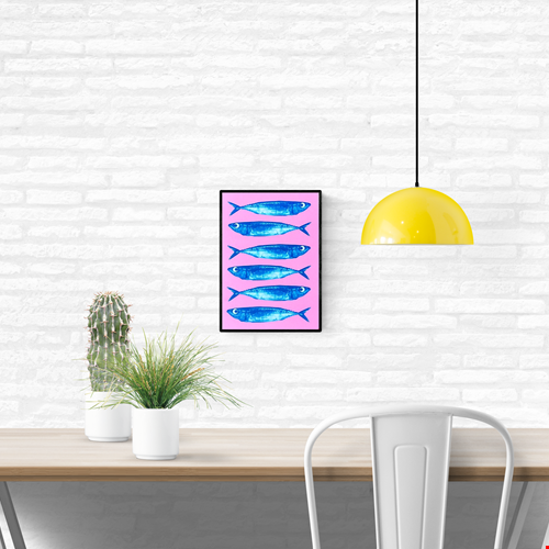 Bright pink and blue offset print of sardines by Dutch illustrator PTRVRKD – playful modern seafood illustration with seven blue fish on bold pink background, printed with eco-friendly soy inks on 250 gsm Biotop paper, handmade in the Netherlands – quirky small art print for kitchens or walls.