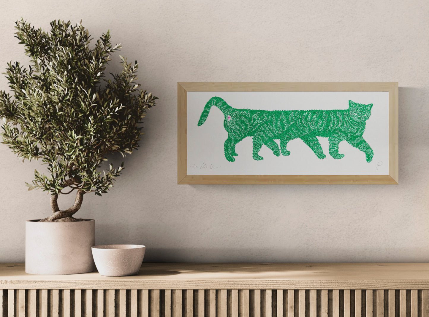 Horizontal risograph illustration of an unusually long green striped cat with a small pink detail, printed on white paper. Playful contemporary wall art for quirky interiors and cat lovers.