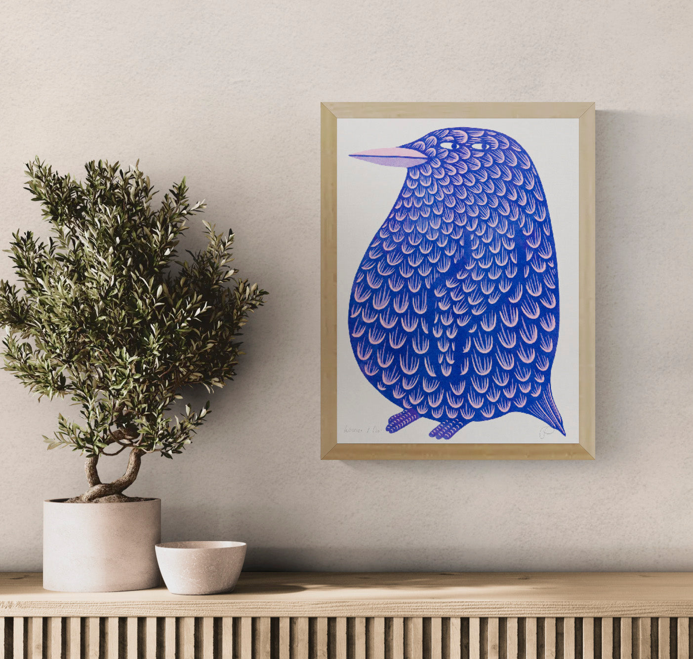Blue and pink penguin risograph by Strangford, shown in portrait orientation with patterned feathers and a humorous expression, playful wall art for colourful contemporary home decor.