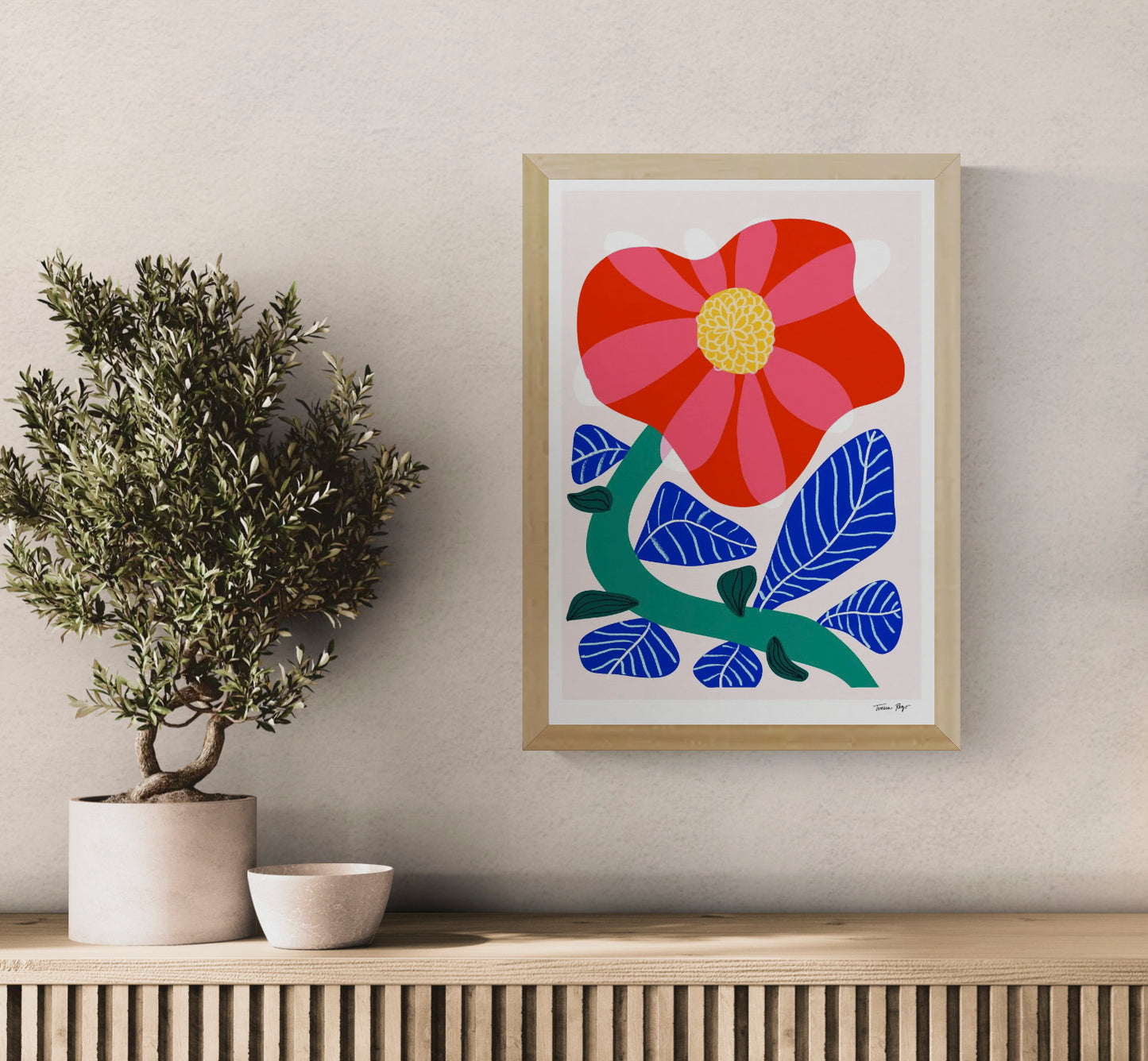 Vertical A3 giclée print of a large red and pink camellia with cobalt blue leaves and a green stem, created in Teresa Rego’s bold botanical style for colourful wall decor.
