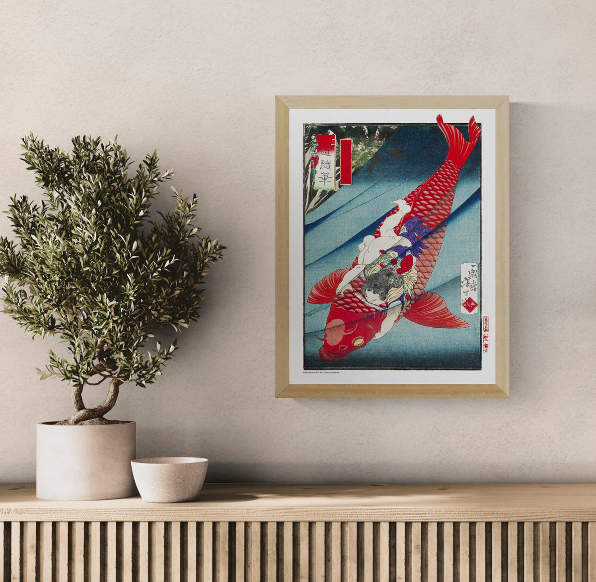Japanese ukiyo-e scene by Tsukioka Yoshitoshi showing Oniwakamaru riding a giant red fish, with vivid red, teal and blue tones. Vertical digital print for bold wall decor.