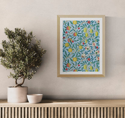 Four Fruits by William Morris, vertical botanical digital print with citrus fruits, pomegranates, flowers and green leaves on a light blue background, ideal as colorful wall art.