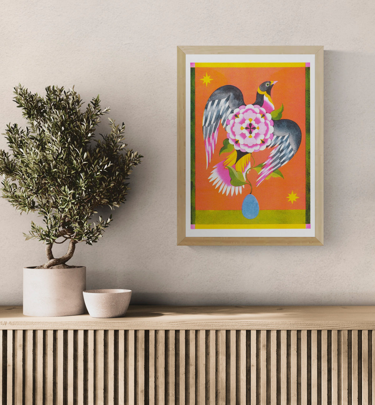 Colorful vertical risograph print by Lou Benesch featuring a black bird with outstretched wings around a large pink flower, with orange, yellow, green and blue tones, ideal as playful wall art.