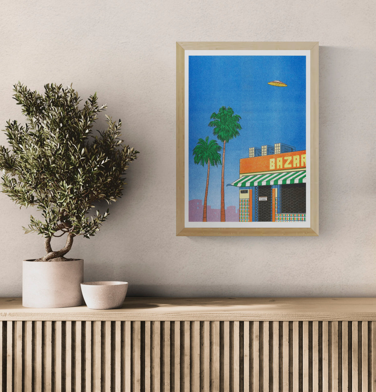 Spain at 15h by Simon Bailly, vertical risograph print with palm trees, a closed Spanish bazaar, blue sky and flying UFO in vivid blue, orange and green tones, ideal as playful wall art.