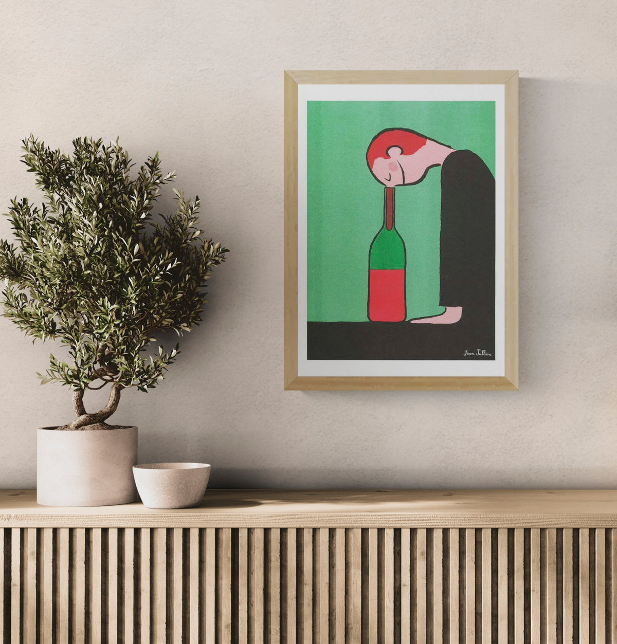 Bottle by Jean Jullien, A3 portrait risograph showing a red-haired figure resting his head on a green bottle, with green, red and black tones, ideal as playful contemporary wall art.