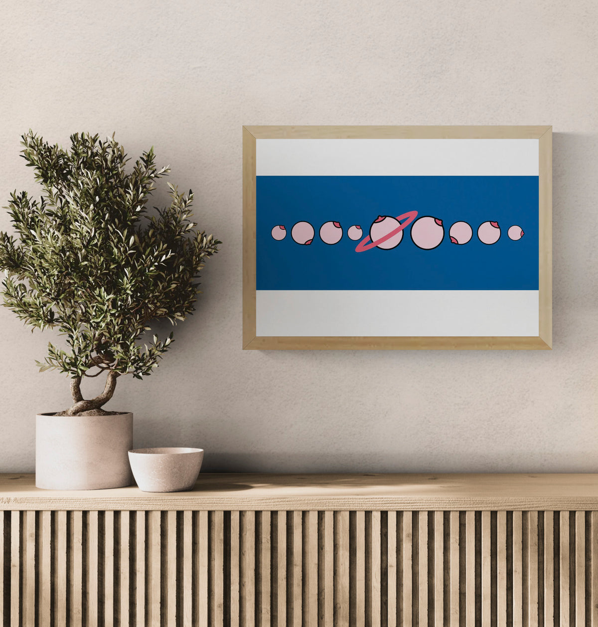 Solar by Studio Stoutpoep, horizontal digital art print showing pink illustrated breasts arranged like a solar system on a deep blue background, playful contemporary wall decor.