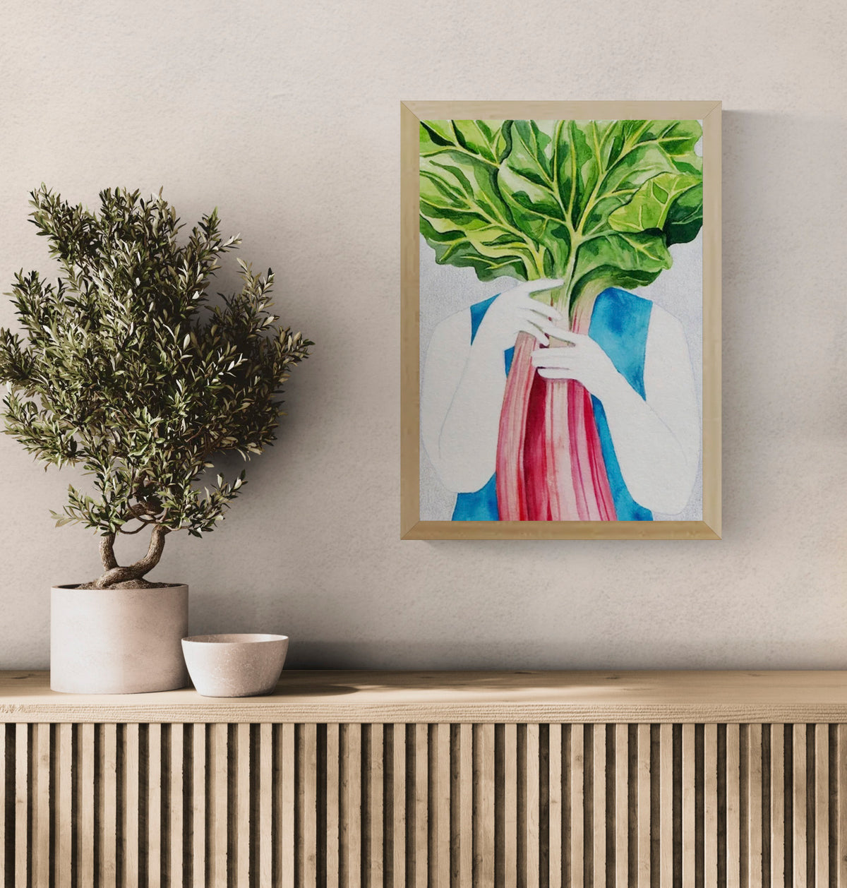 Surreal watercolor illustration of a person holding vibrant rhubarb leaves in front of their face, printed as a vertical giclée art print in rich green, pink, and blue tones, ideal for kitchen wall art and contemporary home décor.