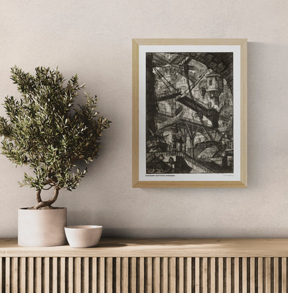 The Drawbridge by Giovanni Battista Piranesi, black and white architectural etching showing overlapping bridges, staircases and vaulted stone structures. Vertical digital art print for classic or industrial wall decor.