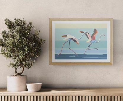 Contemporary A3 art print titled Take off by Belgian duo Floor 4 Productions. Features two flamingos mid-run across a stylized water surface with bold pastel tones and geometric lines. Printed on 300g paper, perfect for colorful and energetic home decor.