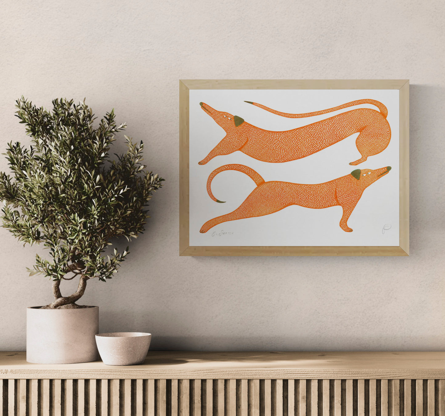Big Stretch by Strangford, horizontal risograph art print showing two elongated orange dogs with olive details on white, playful contemporary wall art for colourful interiors.