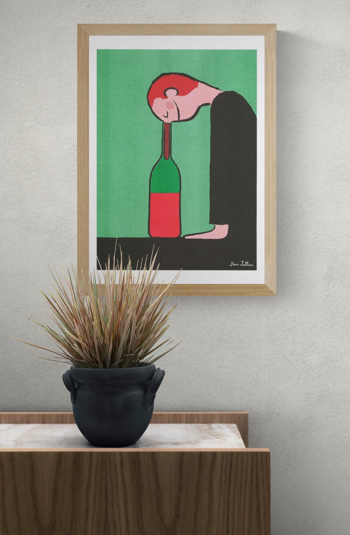 Bottle by Jean Jullien, A3 portrait risograph showing a red-haired figure resting his head on a green bottle, with green, red and black tones, ideal as playful contemporary wall art.