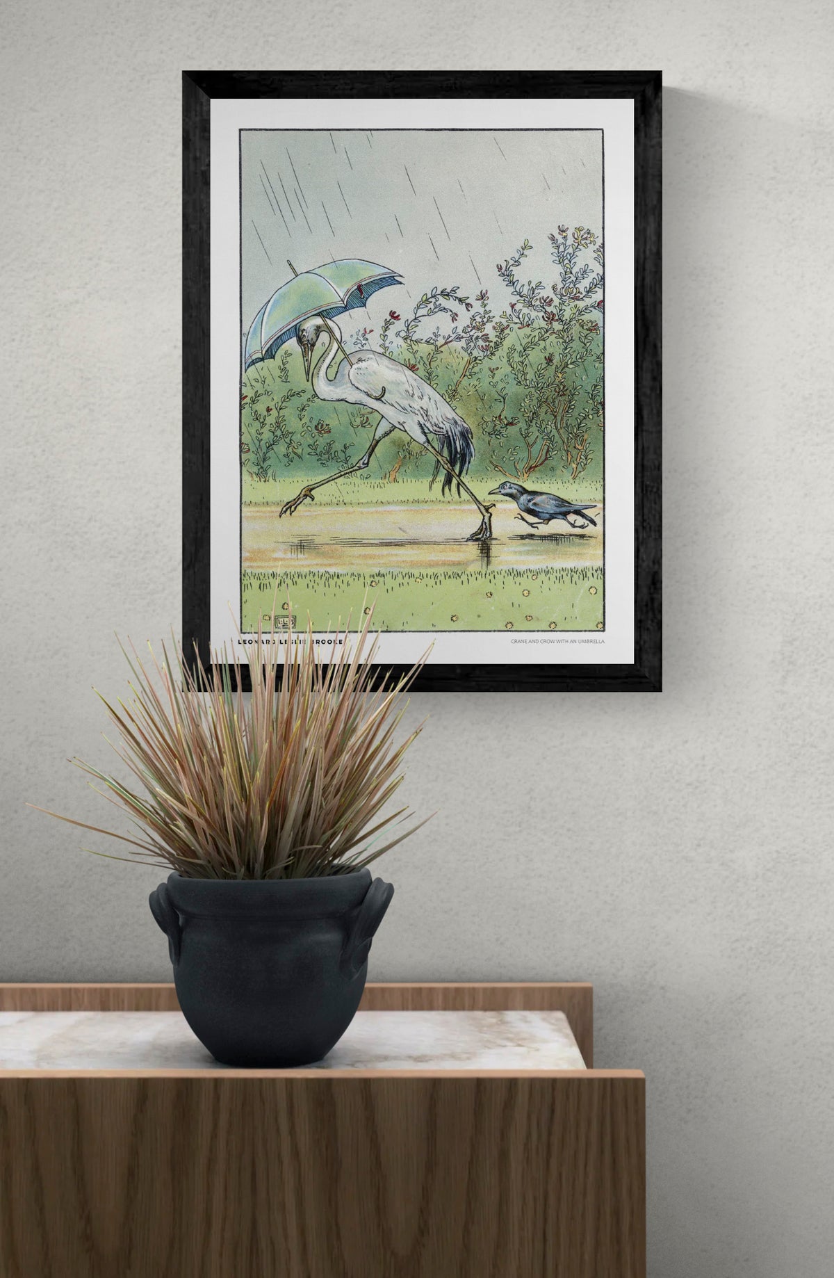 Vintage storybook illustration by Leonard Leslie Brooke of a white crane walking under a blue-green umbrella with a black crow in the rain. Soft green, blue and yellow tones. Vertical digital art print for whimsical wall decor.