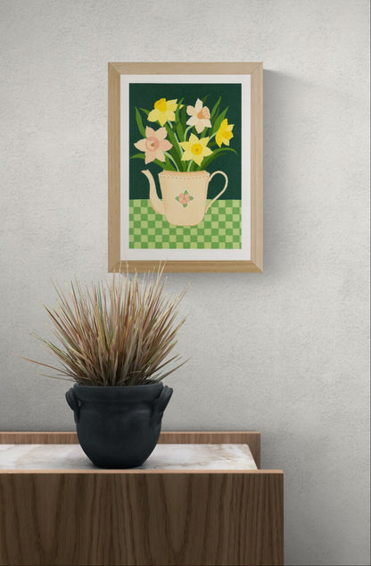 Botanical art print “Daffodils” by Leens featuring bright yellow daffodil flowers in a blue striped teapot on a pink table. Warm floral wall art with vintage colours for cozy kitchen and Scandinavian-style interiors.