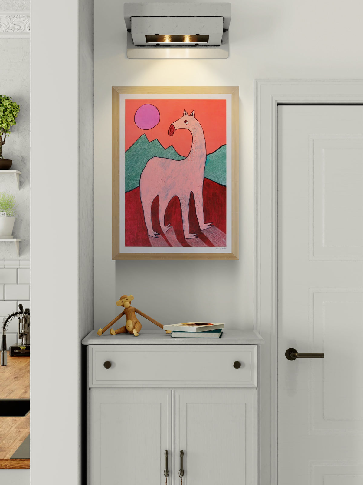 Playful and surreal illustration titled 'Beest 1' by Louise de Meester, featuring a quirky pink creature with an elongated neck set against bold red mountains, green hills, and a purple sun – a whimsical and bold art print for contemporary interiors