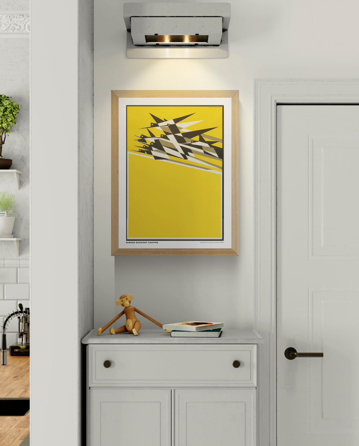 Vertical vintage modernist poster by Edward McKnight Kauffer showing a flock of geometric black, white, and grey birds flying across a bright yellow background. Digital art print with Art Deco influences for bold wall decor.