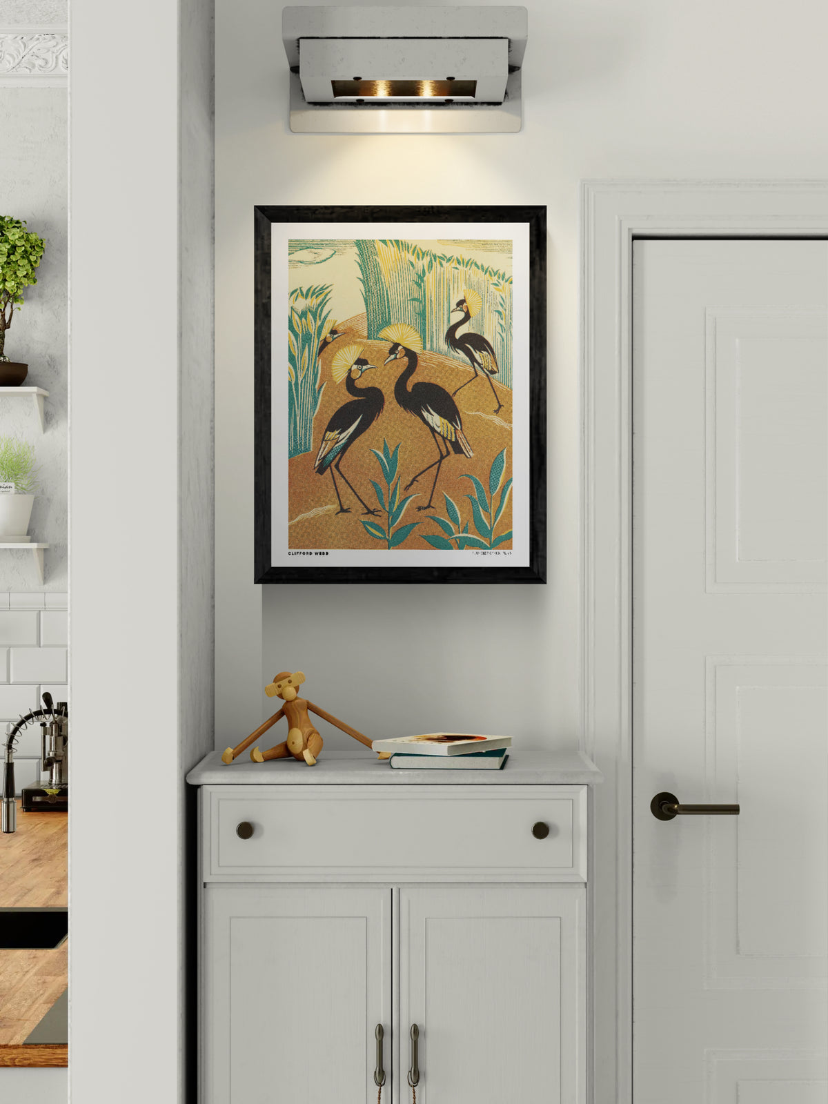 Vintage-style vertical illustration of four black crowned cranes with golden feather crests among teal reeds and warm orange earth. A Jungle Picknick by Clifford Webb, reproduced as a digital wall art print.