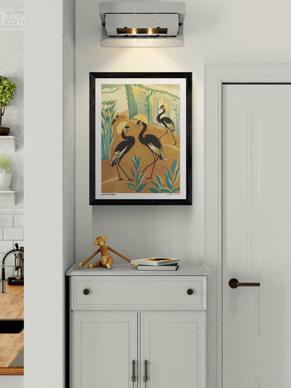 Vintage-style vertical illustration of four black crowned cranes with golden feather crests among teal reeds and warm orange earth. A Jungle Picknick by Clifford Webb, reproduced as a digital wall art print.