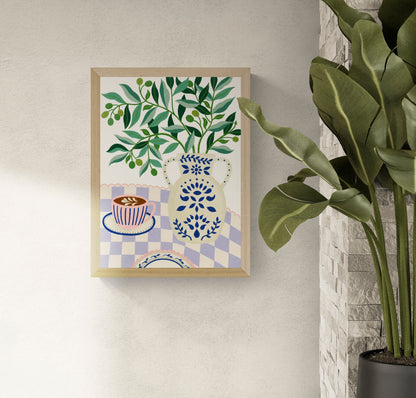 Greek Patio by Leens, colorful Mediterranean-inspired digital art print featuring olive branches in a decorative blue ceramic vase beside a pink coffee cup on a lilac checkered tablecloth, botanical wall art for cozy kitchens and modern interiors.