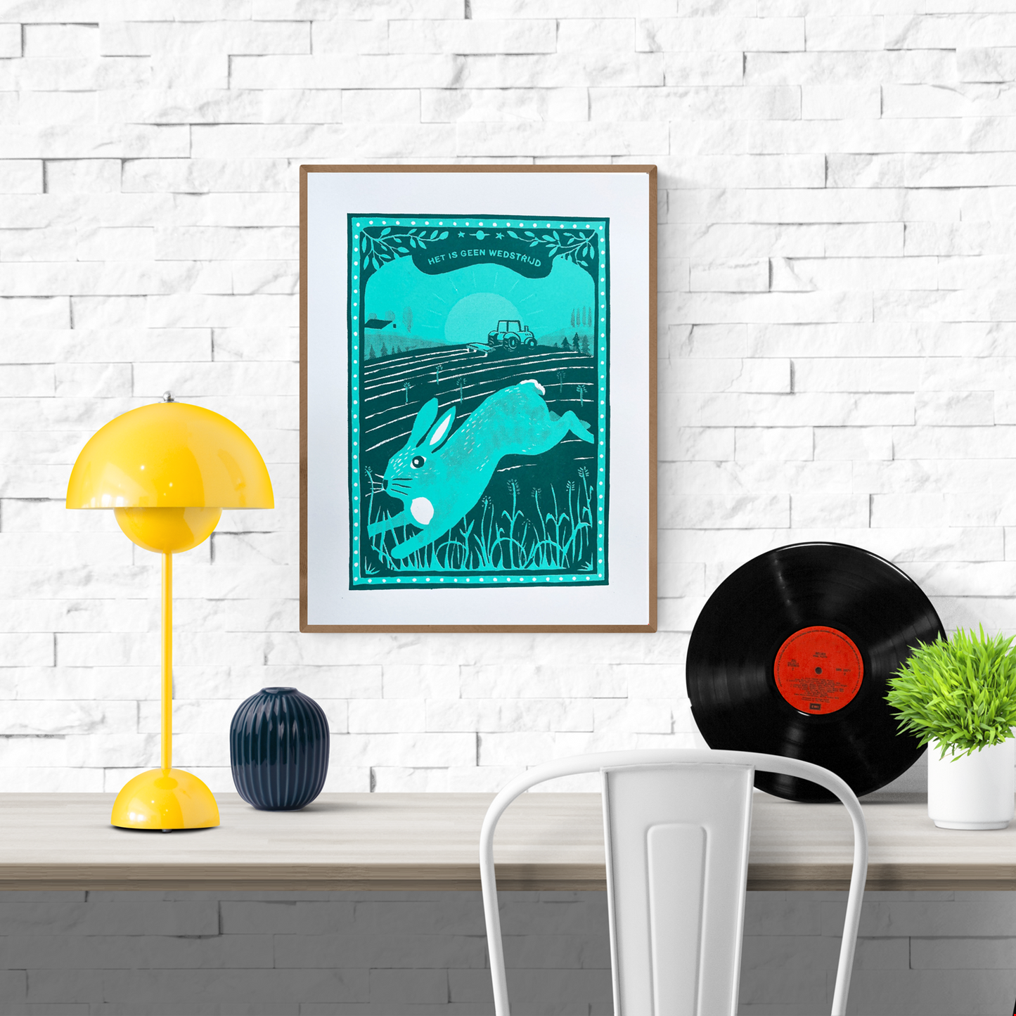 Two-colour screen print by Belgian illustrator Dennis Dellaert featuring a turquoise hare leaping across farmland at sunrise, with a tractor in the background and the Dutch phrase “Het is geen wedstrijd.” Nature-inspired wall art in a bold teal palette, 30×40 cm, limited edition.