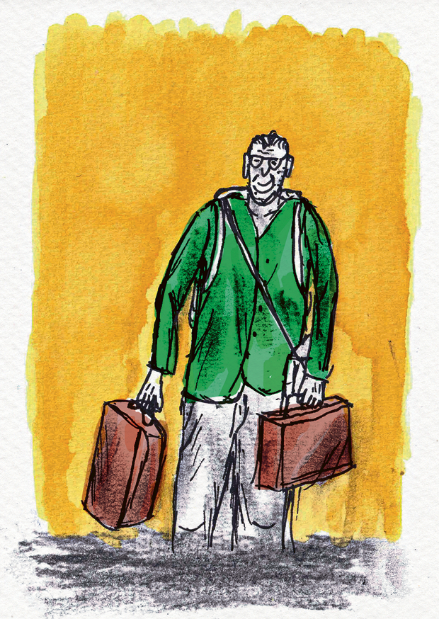 A6 art card titled “De reiziger” by Belgian illustrator Ilia Claus. Features a man with glasses wearing a green shirt, carrying two brown suitcases against a bright yellow watercolor background. Printed on 350g paper with matching envelope.