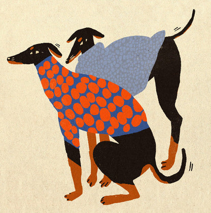 Colorful Doggos art print by Enikő Eged featuring two stylized black dogs wearing patterned sweaters in blue, orange, and grey tones on a warm neutral background, square contemporary giclée wall art for modern interiors.