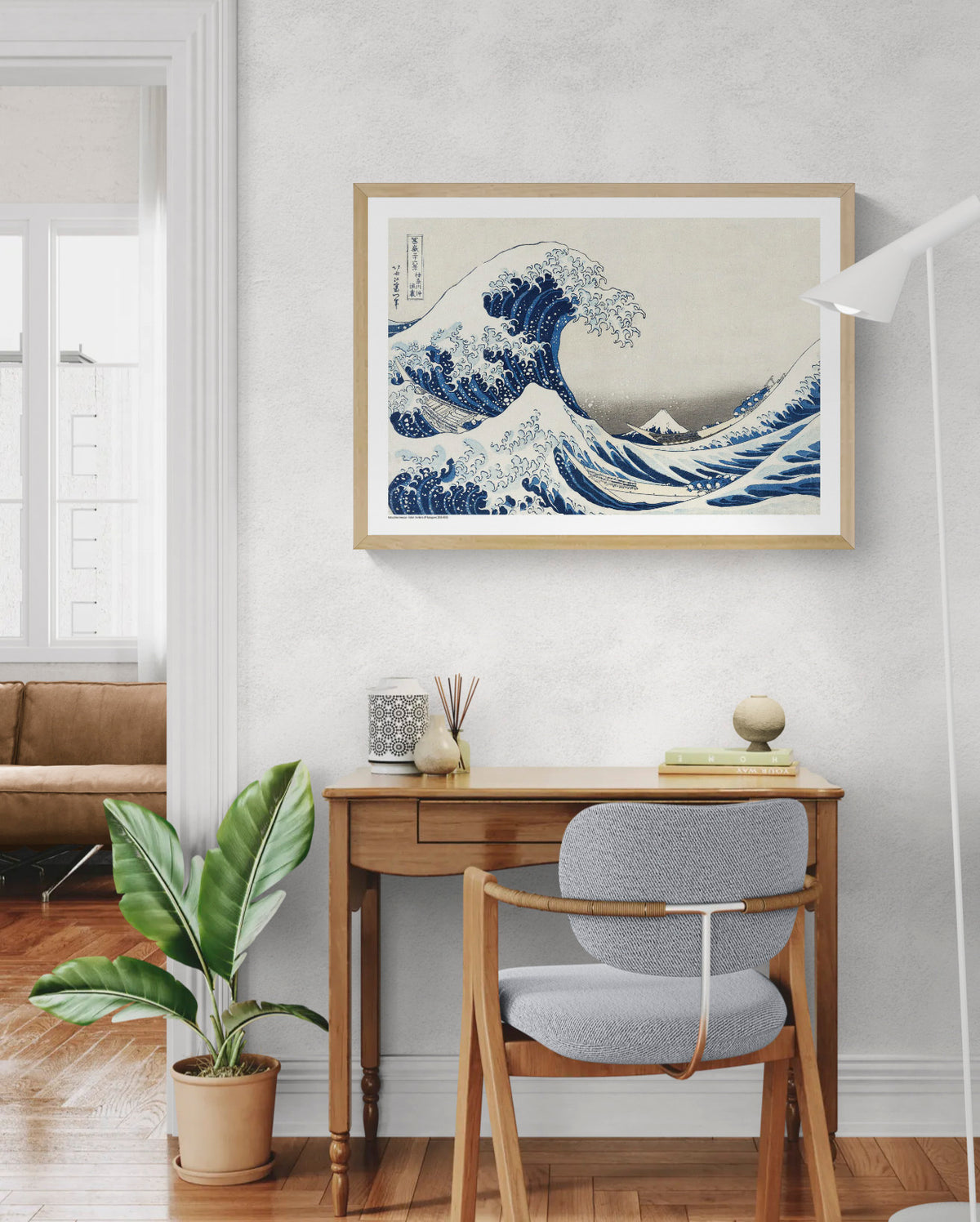 Katsushika Hokusai Under The Wave art print showing towering blue ocean waves, fishing boats and Mount Fuji in classic Japanese ukiyo-e style, horizontal format for living room or office wall decor.