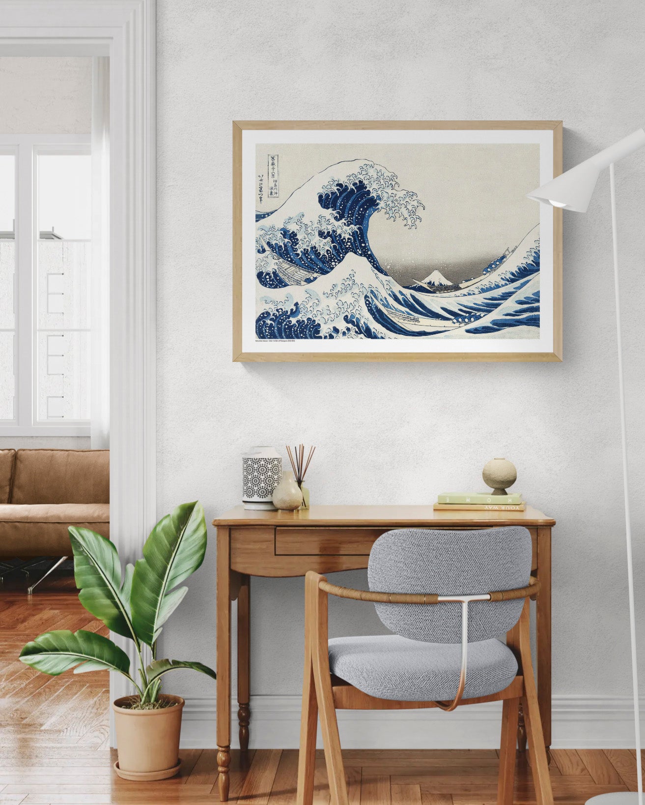 Katsushika Hokusai Under The Wave art print showing towering blue ocean waves, fishing boats and Mount Fuji in classic Japanese ukiyo-e style, horizontal format for living room or office wall decor.