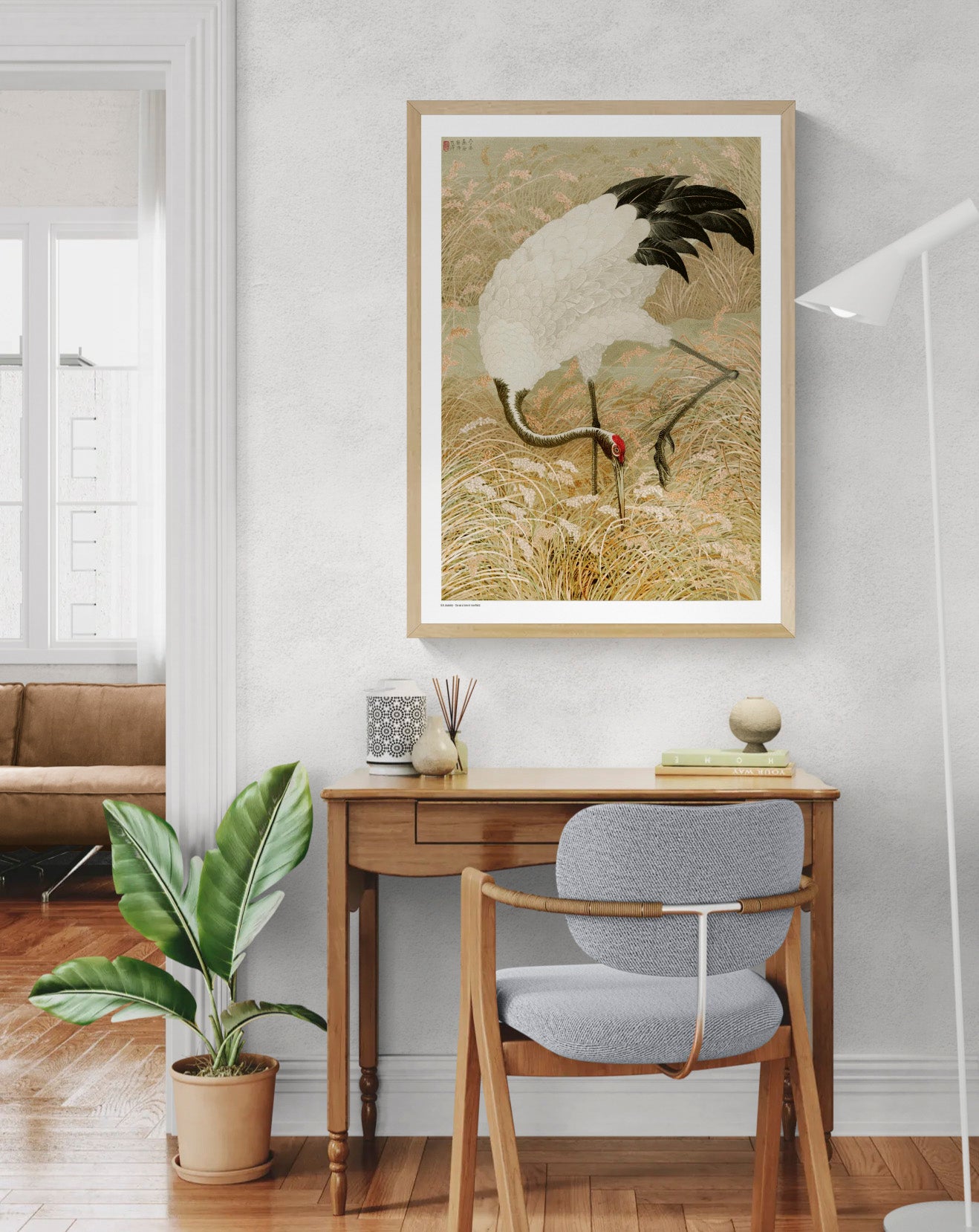Sarus crane standing among tall rice grasses and flowering plants in muted beige, cream, black and coral tones, Japanese-inspired vertical digital art print for elegant wall decor.