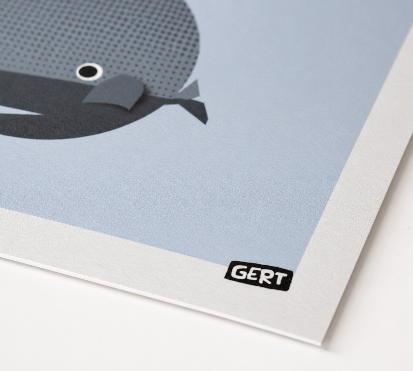 Whales by Gert Paenen, minimalist whale art print featuring three geometric whales in blue, black and grey tones on a soft blue background, contemporary marine life wall art for modern home decor.