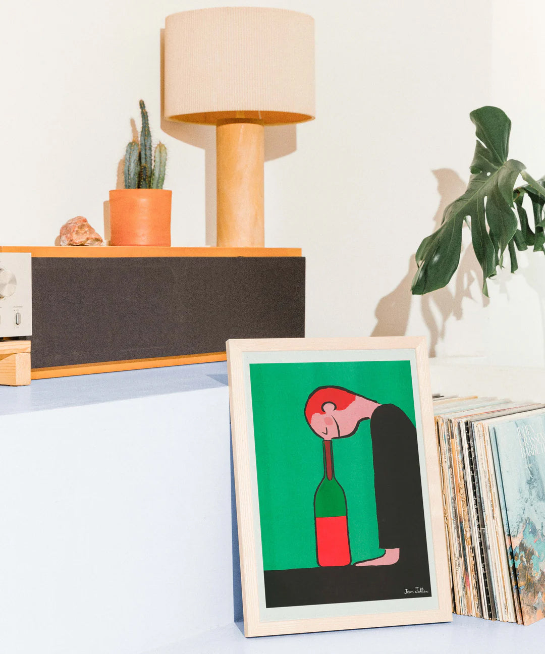 “Bottle” by French illustrator Jean Jullien – a risograph art print featuring a minimalist figure resting its head against a wine bottle, rendered in bold black, red, and green on Munken paper. A witty and emotional artwork that blends humor, simplicity, and design — perfect for modern interiors and collectors of contemporary illustration.