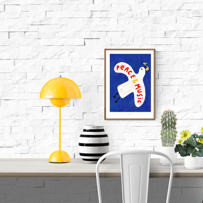 Colorful art print of a white pigeon carrying a yellow musical note on a deep blue background with the hand-painted phrase “Peace & Music” in red and yellow letters. Whimsical and modern illustration by Just Cool Design, perfect wall art for music lovers and optimistic interiors.