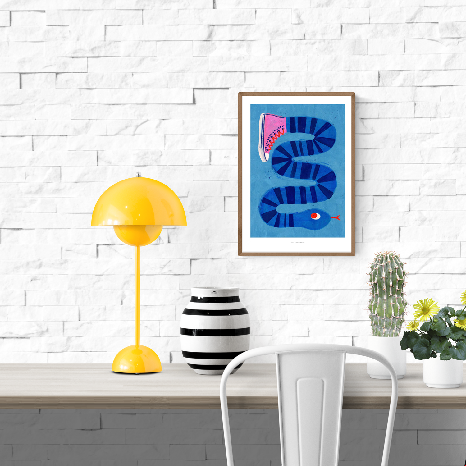 Colorful surreal illustration print by Just Cool Design featuring a long blue striped snake wearing a single pink sneaker, set against a bright blue background. Modern, quirky wall art for playful interiors and design lovers.