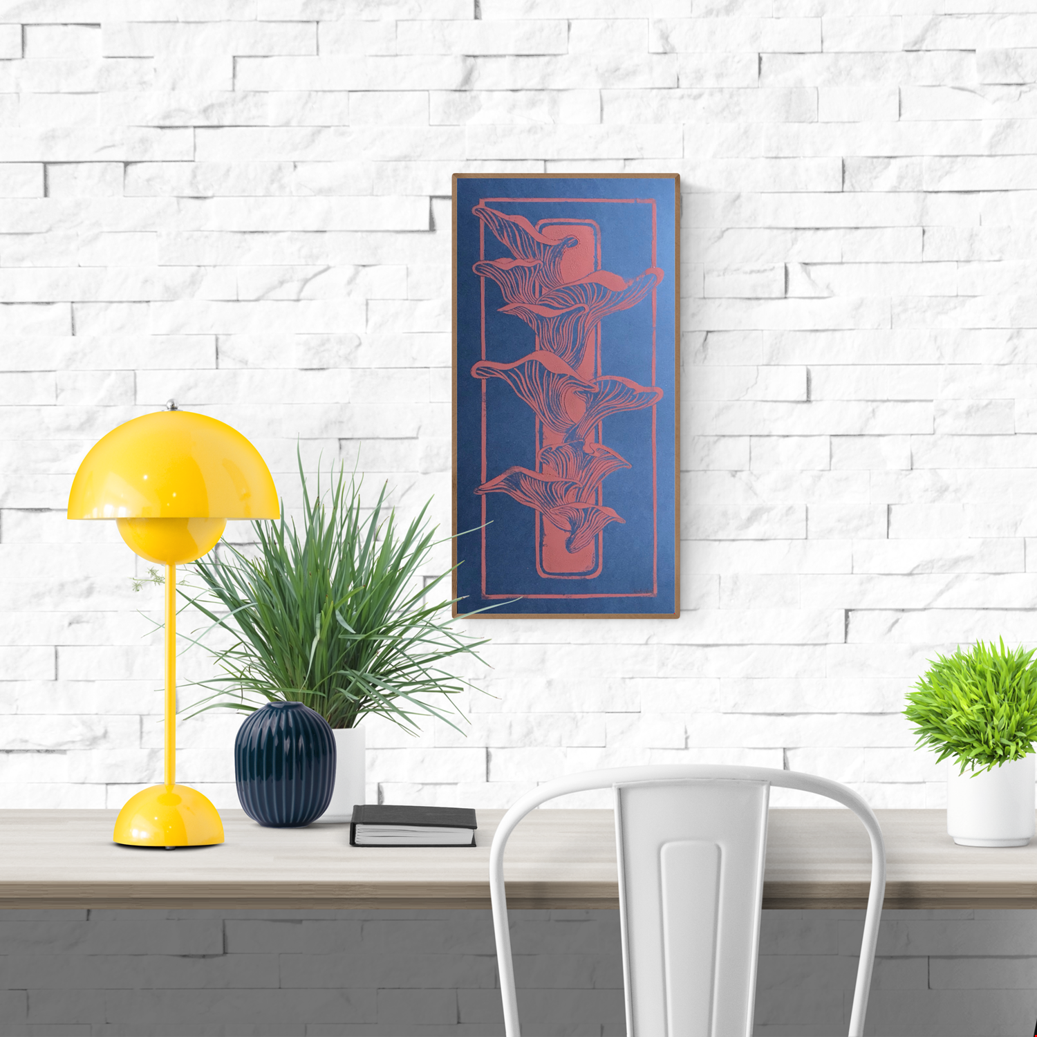Handmade linocut print of coral-colored mushrooms growing from a piece of wood on a deep blue background; organic nature-inspired artwork, 25.5 x 50 cm by Belgian artist Leda Vaes.
