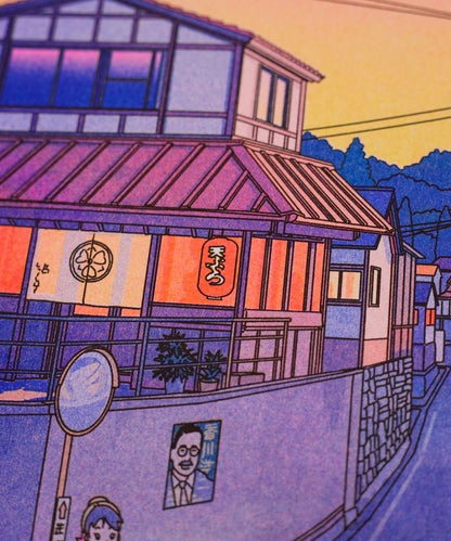 “Nowhere in Japan” risograph print by Liam Cobb – A3 art print showing a calm Japanese suburban street at sunset with pink, purple, and yellow hues, power lines above, and a cat in the foreground. Retro-inspired color palette, cinematic light, and detailed linework create a nostalgic and poetic atmosphere. Perfect for lovers of Japanese urban scenery and modern illustration.