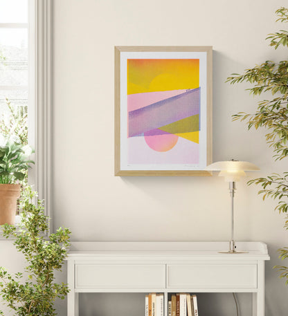 Dune Landscape - Two Suns by PTRVRKD, vertical A3 risograph print with yellow suns, pink dunes, violet hills and tiny figures, ideal as colourful contemporary wall art.